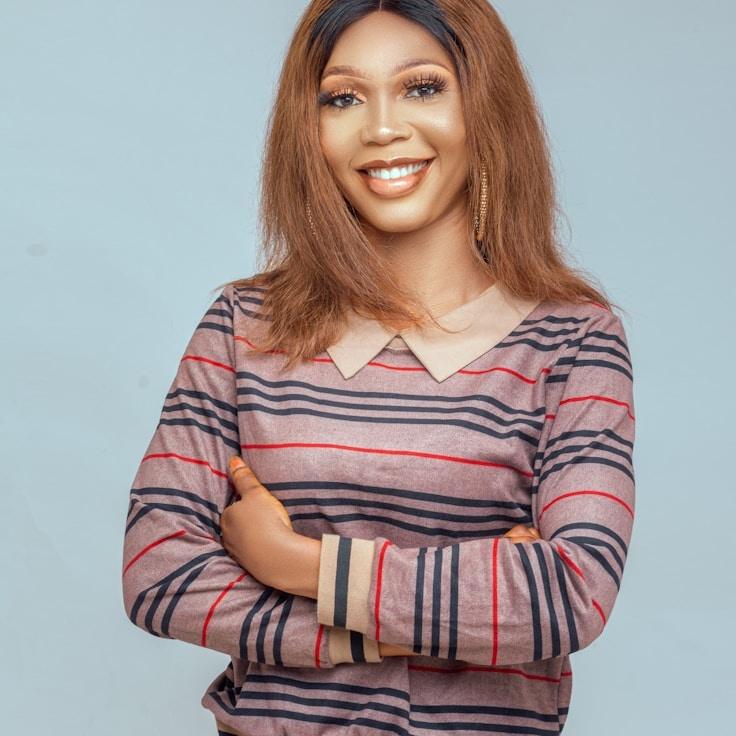 Kaveri Mehta, Lead Design Curator at ForestPaperLoft, reviewing corporate floral arrangements